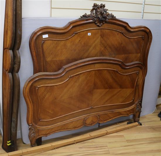 A Louis XV style walnut double bedstead W.145cm